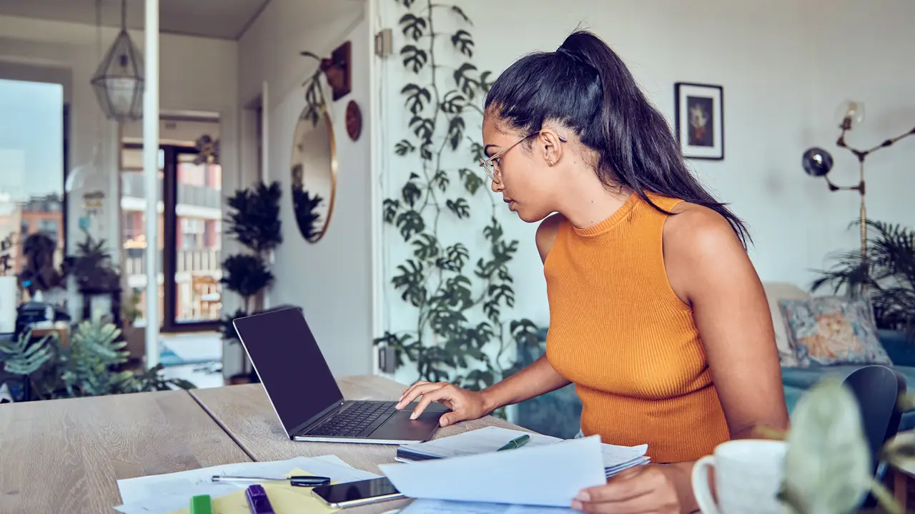 Young professional reading financial education material